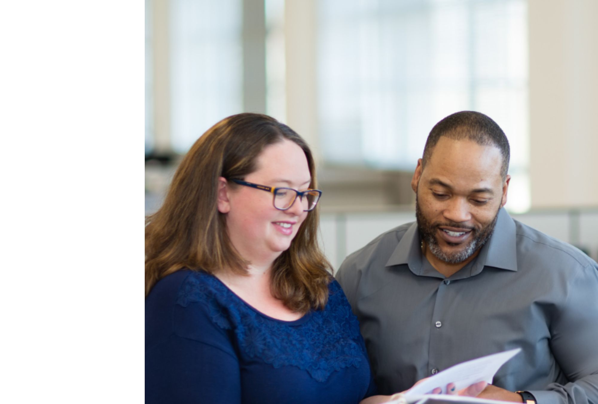 Man and woman looking at papers.