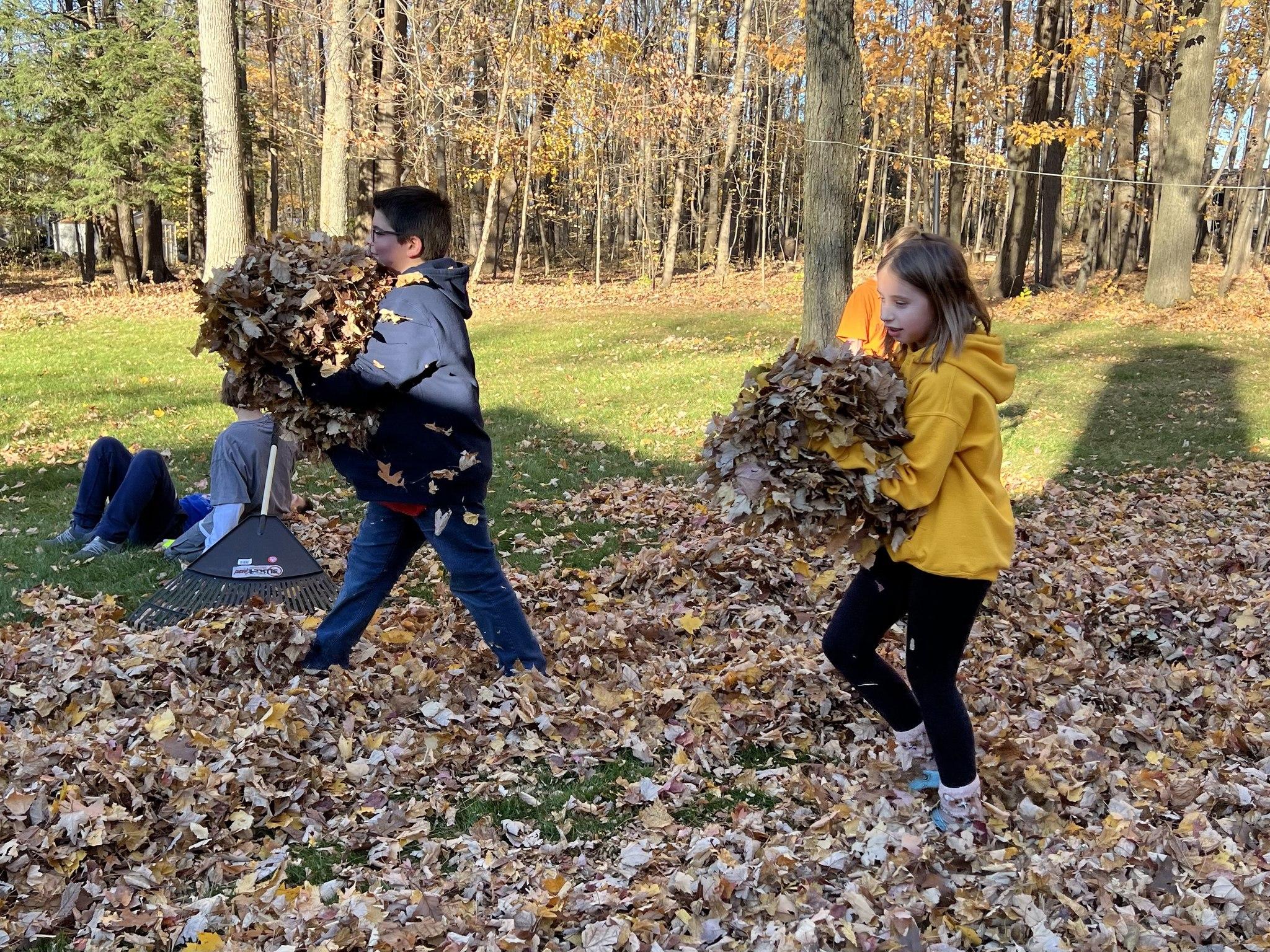 Two girls with leaves 