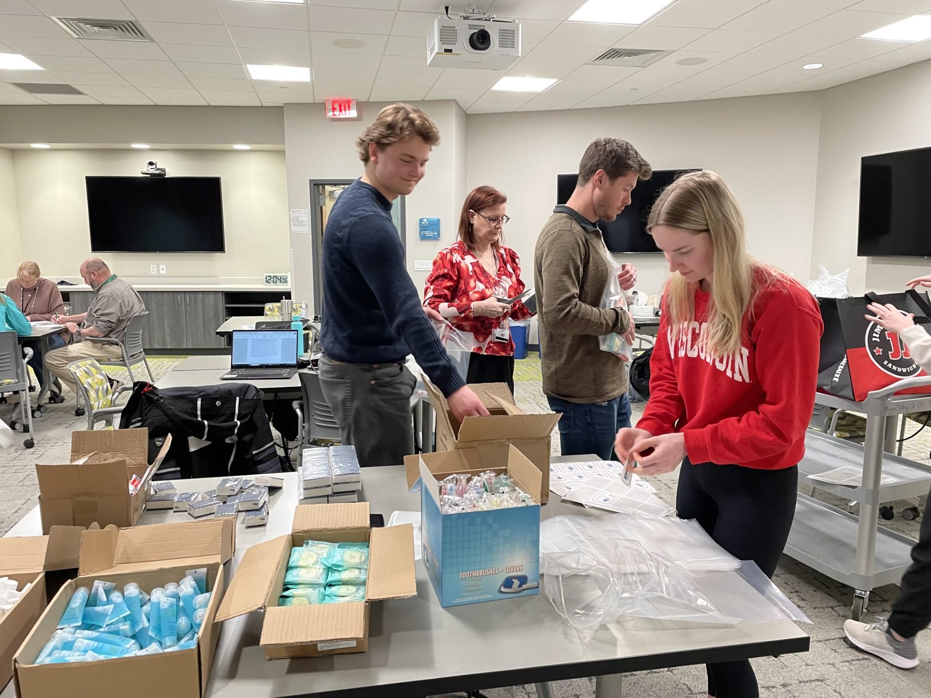 People putting together hygiene kits