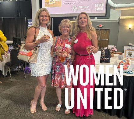 Three women standing 
