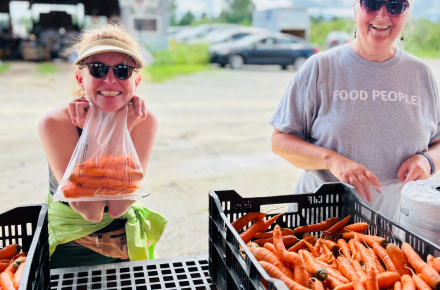 Two women with carrots