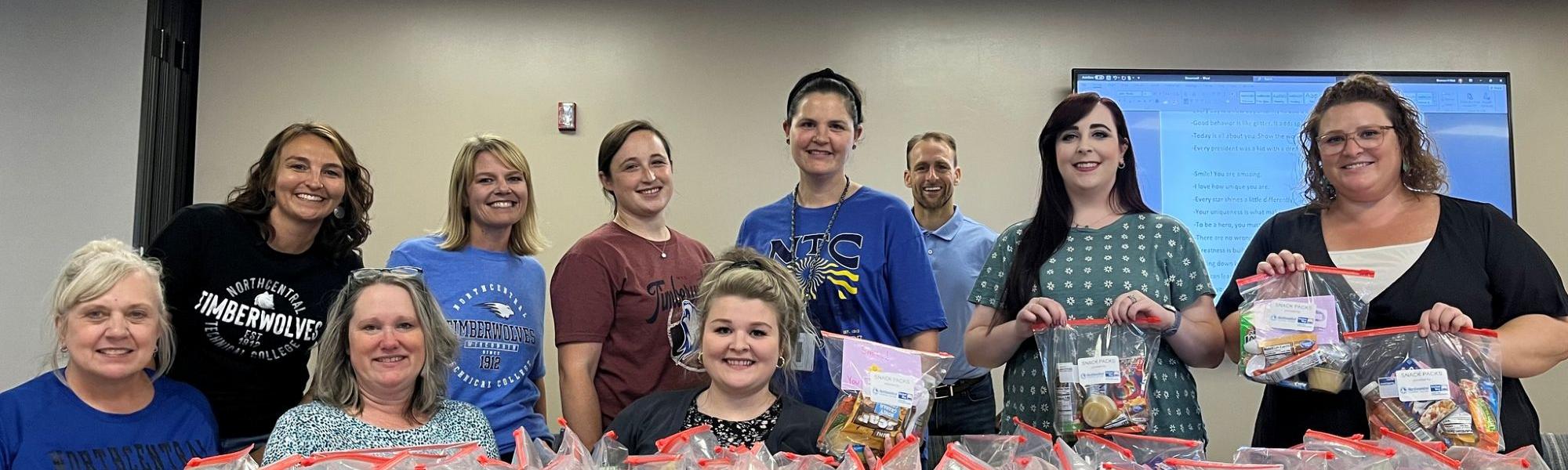 Group of People making care kits